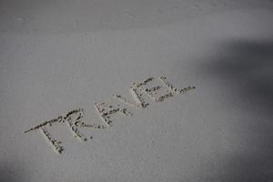 palavra na areia escrita foto