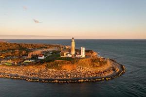 Montauk farol e de praia às nascer do sol, grandes ilha, Novo Iorque, EUA. foto