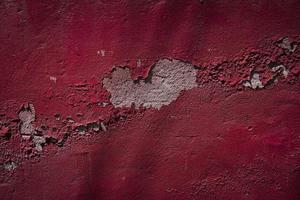 velho vermelho cimento quebrado parede, desenho textura fundo antigo pedra rude Forte construção, vermelho concreto padrão, para vermelho fundo textura foto