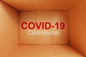uma coronavírus pandemia etiquetado covid-19 dentro uma Entrega serviço cartão caixa. foto