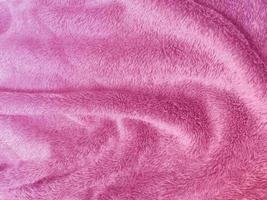 fundo de textura de lã limpa rosa. lã de ovelha natural leve. algodão sem costura rosa. textura de pele fofa para designers. tapete de lã rosa de fragmento de close-up. foto