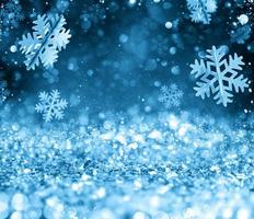 abstrato brilhando Natal azul fundo com flocos de neve foto