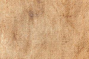 pastel abstrato hessian ou pano de saco serapilheira tecido tecido textura fundo dentro amarelo bege creme sépia Castanho cor foto