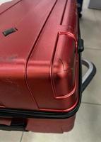 vermelho quebrado mala de viagem foto