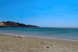 cretense Grécia azul mar com areia de praia cenário foto