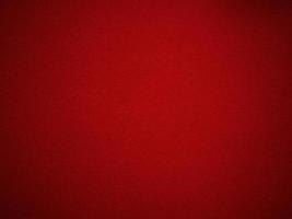 textura de tecido de veludo vermelho usada como plano de fundo. fundo de tecido vermelho vazio de material têxtil macio e liso. há espaço para o texto. foto