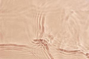 fundo de textura de água bege. padrão abstrato foto