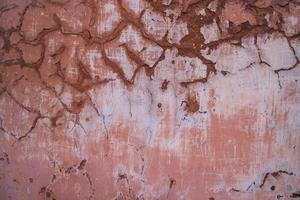 a textura do a velho rústico parede é coberto com Rosa reboco foto