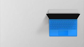 computador portátil azul laptop vista superior filmada em fundo cinza foto