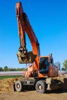 escavadora em construção site, vertical tiro foto