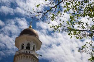 minarete com verde plantar às masjid Kapitan Keling foto