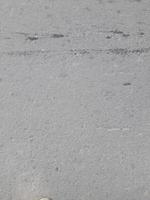 asfalto rude grunge superfície, desatado asfalto Sombrio cinzento rude estrada, fundo textura, topo Visão foto