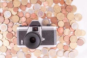 Câmera e moedas foto