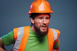 emocional construtores laranja Difícil chapéu segurança trabalhos fadiga azul fundo foto