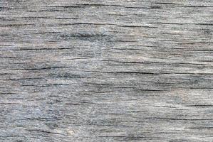 Madeira compensada resistido cinzento textura com madeira fibra, rachaduras e manchas do podridão e mofo foto