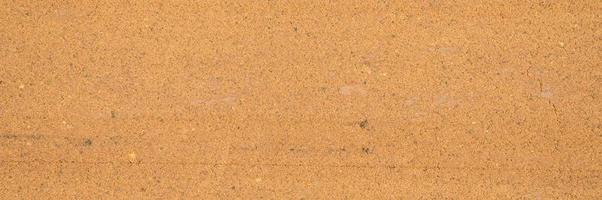 textura de fundo da superfície solta da areia e do solo foto