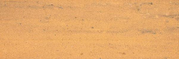 textura de fundo da superfície lisa da areia foto