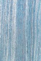 textura do azul resistido de madeira parede com descamação velho pintura e rachaduras foto