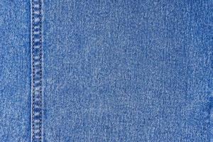 jeans azul com um fundo de textura de costura foto