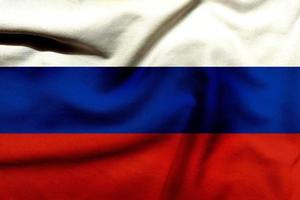 russo bandeira em a texturizado pano, contemporâneo levar em a vermelho, branco, e azul russo bandeira foto