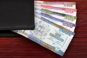 liberiano dólar - Novo Series do notas dentro a Preto carteira foto