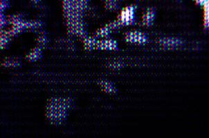 padrão de fundo abstrato de pontos coloridos borrados em um fundo escuro close-up foto