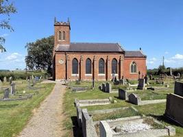 uma Visão do Moreton corbeta Igreja e cemitério foto