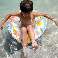 feliz indiano Garoto natação dentro uma piscina, criança vestindo natação traje ao longo com ar tubo durante quente verão Férias, crianças Garoto dentro grande natação piscina. foto