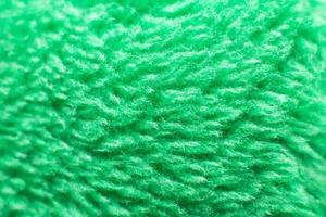 textura têxtil fofa verde. closeup de fundo peludo fralda. foto