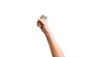 isolado imagem do fêmea mão segurando uma agrupar do dólares em branco fundo. topo Visão do Forma de pagamento conceito foto