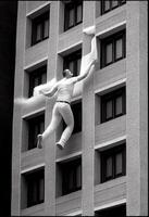 homem suspensão a partir de a lado do uma alta prédio. generativo ai. foto