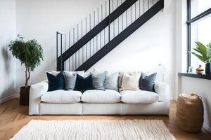 confortável suave sofá com decorativo almofadas dentro espaçoso moderno vivo quarto com parquet chão e branco paredes perto Escadaria dentro luz do dia, ai gerado foto