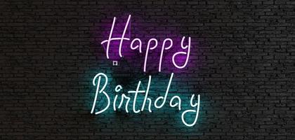 letreiro de néon com a frase feliz aniversário em um fundo escuro foto