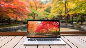 em branco tela computador portátil computador em terraço com lindo outono colorida vermelho e amarelo bordo folhas fundo, generativo ai foto