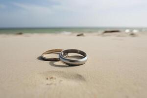 dois Casamento argolas dentro a areia em a fundo do uma de praia e mar. ai gerado foto