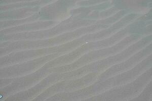 branco areia textura fundo com onda padronizar foto