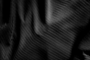 Sombrio Preto e cinzento borrado gradiente e linha do pano ou tecido fundo tem uma pequeno abstrato claro. foto