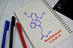 remifentanil molécula escrever em a livro. estrutural químico Fórmula. Educação conceito foto