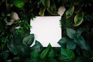 branco papel cartão em deitar verde folhas textura topo Visão fundo. criativo disposição dentro natureza conceito. ai gerado foto