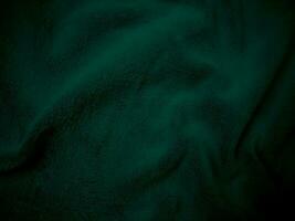verde limpar \ limpo lã tecido textura fundo. luz natural ovelha lã. verde desatado algodão. textura do fofo pele para designers. fechar-se fragmento lã tapete. foto