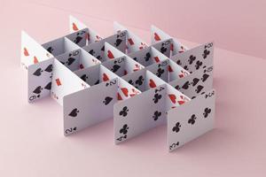 estrutura feita de cartas em fundo rosa foto