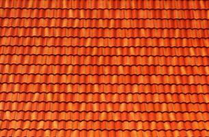 laranja cobertura azulejos ter uma desatado textura e cobertura padronizar. a conceito para a cobertura telhado ícone com Castanho coberturas azulejos. bandeira textura para telhados. foto