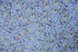 grupo de pilhas de dinheiro de notas de 100 dólares americanos como textura de fundo foto
