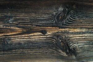 fechar acima do velho cinzento madeira borda. foto
