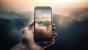 mão segurando telefone captura nascer do sol em montanha gerado de ai foto