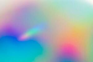 desfoque abstrato fundo iridescente de folha de arco-íris holográfica foto