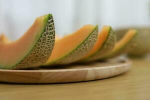 frutas para cuidados de saúde verde Melão de madeira mesa querida Melão ou Cantalupo foto