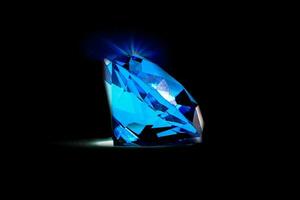 lindo diamante azul em fundo preto isolado foto