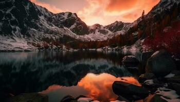 majestoso montanha alcance reflete tranquilo pôr do sol sobre sereno lagoa gerado de ai foto