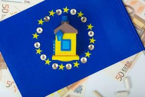 europeu bandeira, casa e moeda.fundo foto